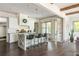 A modern, open-concept kitchen with stainless appliances, a central island, and sleek finishes at 4496 Sardis Church Rd, Buford, GA 30519