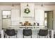 Close up of a kitchen island featuring granite countertops, a sink, and pendant lighting at 4496 Sardis Church Rd, Buford, GA 30519