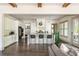 A modern, open-concept kitchen with stainless appliances, a central island, and sleek finishes at 4496 Sardis Church Rd, Buford, GA 30519