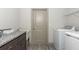 Convenient laundry room with modern appliances and ample counter space at 4496 Sardis Church Rd, Buford, GA 30519