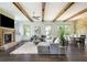 Inviting living room featuring a brick fireplace and an abundance of natural light at 4496 Sardis Church Rd, Buford, GA 30519