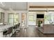View of the kitchen island and living room with fireplace and exposed wooden beams at 4496 Sardis Church Rd, Buford, GA 30519