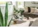 Living room decor including a round coffee table and built-in shelving at 4496 Sardis Church Rd, Buford, GA 30519