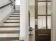 Staircase leading to the second floor, with a view of an exercise room at 4496 Sardis Church Rd, Buford, GA 30519