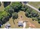 Aerial view of the property showing the large, fenced backyard and surrounding trees at 524 Trousseau Ln, Mcdonough, GA 30252