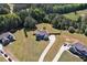 Aerial view showcasing the home's position on a green lot in a neighborhood setting at 524 Trousseau Ln, Mcdonough, GA 30252