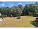 Expansive backyard features lush greenery, a play set, and ample space for recreation at 524 Trousseau Ln, Mcdonough, GA 30252