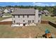 Spacious backyard with patio, barbecue grill, fencing, and playground set at 524 Trousseau Ln, Mcdonough, GA 30252