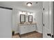 Bright bathroom with double vanity, granite countertop, and tile flooring at 524 Trousseau Ln, Mcdonough, GA 30252