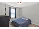 This is a cozy bedroom with carpet, a window, and a small twin bed at 524 Trousseau Ln, Mcdonough, GA 30252