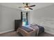 Standard bedroom featuring a ceiling fan and window with natural light at 524 Trousseau Ln, Mcdonough, GA 30252