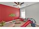 Playful bedroom featuring brightly painted accent wall and toys at 524 Trousseau Ln, Mcdonough, GA 30252