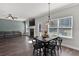 Open-concept dining area with a table set for four and a view to the living room at 524 Trousseau Ln, Mcdonough, GA 30252