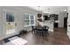 Modern kitchen with stainless steel appliances, ample counter space, and open to the dining area at 524 Trousseau Ln, Mcdonough, GA 30252
