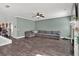Spacious living room with a large sectional sofa, fireplace, and hardwood flooring at 524 Trousseau Ln, Mcdonough, GA 30252