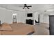 Spacious main bedroom with a tray ceiling, TV, and an en-suite bathroom at 524 Trousseau Ln, Mcdonough, GA 30252