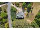 Overhead view of the home showing the roofline, driveway, and landscaping at 550 Vinings Springs Se Dr, Mableton, GA 30126