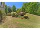 Expansive backyard showing the lawn and landscaping at 550 Vinings Springs Se Dr, Mableton, GA 30126