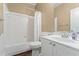 A bright bathroom featuring a bathtub and a white vanity with a sink at 550 Vinings Springs Se Dr, Mableton, GA 30126