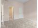 Bright bedroom boasts neutral walls and carpet, with an open bathroom at 550 Vinings Springs Se Dr, Mableton, GA 30126