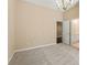 Bedroom with carpet, chandelier, tall ceilings, and an open bathroom at 550 Vinings Springs Se Dr, Mableton, GA 30126