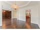 This home features a dining room with beautiful hardwood floors and designer light fixtures at 550 Vinings Springs Se Dr, Mableton, GA 30126