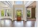 Bright foyer with wood floors, white trim, and a clear view of the landscaped front yard at 550 Vinings Springs Se Dr, Mableton, GA 30126