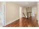 Second-floor hallway features hardwood floors, neutral walls, and white trim at 550 Vinings Springs Se Dr, Mableton, GA 30126