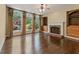 Bright living room featuring a fireplace, built-in bookshelves, and arched windows with outdoor views at 550 Vinings Springs Se Dr, Mableton, GA 30126