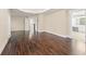 This large main bedroom features beautiful hardwood floors and an ensuite bathroom at 550 Vinings Springs Se Dr, Mableton, GA 30126
