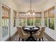 Bright breakfast nook featuring a round table, stylish chairs, and natural light from multiple windows at 550 Vinings Springs Se Dr, Smyrna, GA 30126