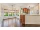 Open-concept kitchen with breakfast bar, wood cabinets and adjacent bright breakfast nook at 550 Vinings Springs Se Dr, Smyrna, GA 30126