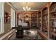Beautiful office with wood bookcases, desk, chair, rug, and picture for sophisticated work at 550 Vinings Springs Se Dr, Smyrna, GA 30126