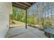 Concrete patio with a serene wooded view, perfect for relaxing outdoors at 550 Vinings Springs Se Dr, Smyrna, GA 30126