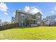 Expansive backyard with lush green grass and a swing set at 6062 Fielder Way, Douglasville, GA 30135