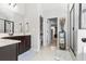 Well-lit bathroom showcasing double sinks, a walk-in shower, and neutral tones for a spa-like experience at 6062 Fielder Way, Douglasville, GA 30135