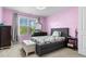 Charming bedroom featuring a window with natural light and a cozy bed at 6062 Fielder Way, Douglasville, GA 30135
