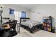 Cozy bedroom with natural light, a desk, and a comfy bed for relaxation at 6062 Fielder Way, Douglasville, GA 30135