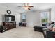 Versatile bonus room perfect for entertaining, complete with plush seating and entertainment center at 6062 Fielder Way, Douglasville, GA 30135