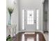 Inviting entryway with a glass-paneled door, complemented by elegant flooring and tasteful decor at 6062 Fielder Way, Douglasville, GA 30135