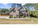 Beautiful two-story home with a landscaped front yard, showcasing its charming curb appeal and inviting entrance at 6062 Fielder Way, Douglasville, GA 30135