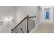 Upstairs hallway with elegant railing showing access to other rooms at 6062 Fielder Way, Douglasville, GA 30135