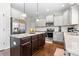 Contemporary kitchen with stainless steel appliances, granite countertops, and ample cabinet space at 6062 Fielder Way, Douglasville, GA 30135