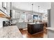 Bright kitchen showcasing granite countertops, a central island, and hardwood floors, open to dining at 6062 Fielder Way, Douglasville, GA 30135