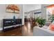 Stylish living area featuring hardwood floors, tasteful decor, and an open layout to the kitchen and dining at 6062 Fielder Way, Douglasville, GA 30135