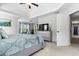 Spacious main bedroom with a tray ceiling, carpeted floors, and soothing colors, creating a serene retreat at 6062 Fielder Way, Douglasville, GA 30135