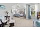 Bright and airy main bedroom featuring a tray ceiling, large windows, and a cozy sitting area for relaxing at 6062 Fielder Way, Douglasville, GA 30135