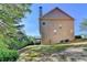 Backyard view of home with large yard at 2272 Misty Brook Ct, Buford, GA 30519