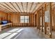 Unfinished basement featuring exposed studs, beams, and a window for natural light at 2272 Misty Brook Ct, Buford, GA 30519