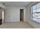 Bedroom with neutral carpet with view into closet and a bright window at 2272 Misty Brook Ct, Buford, GA 30519